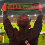 hincha verdolaga con bufanda de Atlético Nacional